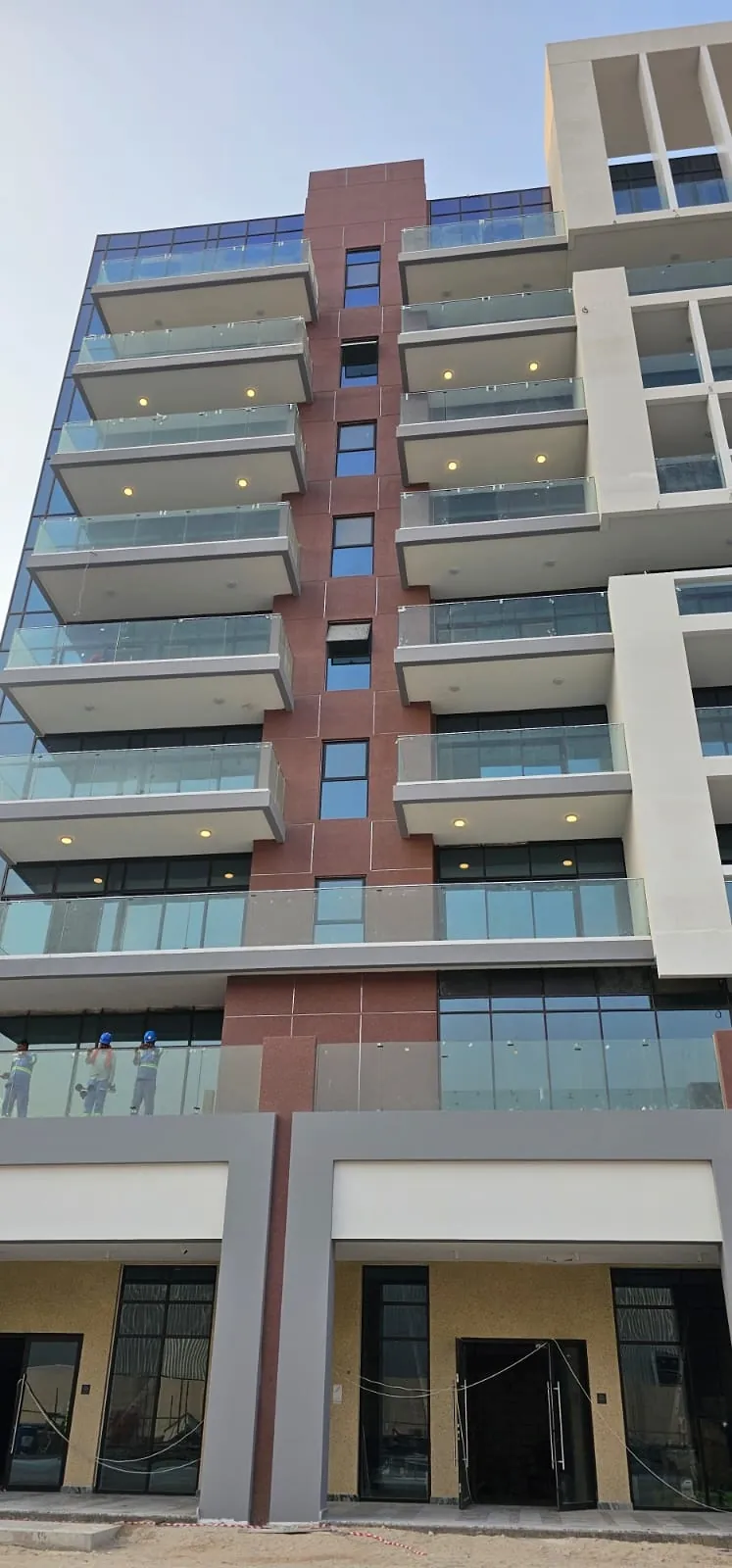 Completed facade coating on a residential building at Azizi Riviera, Dubai